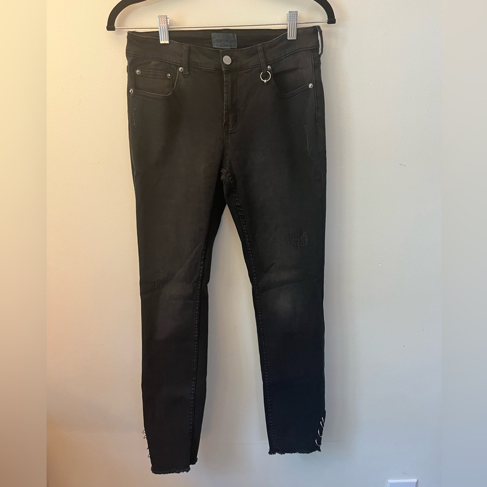 For the Republic black jeans with distressed style and metal rings at ankles